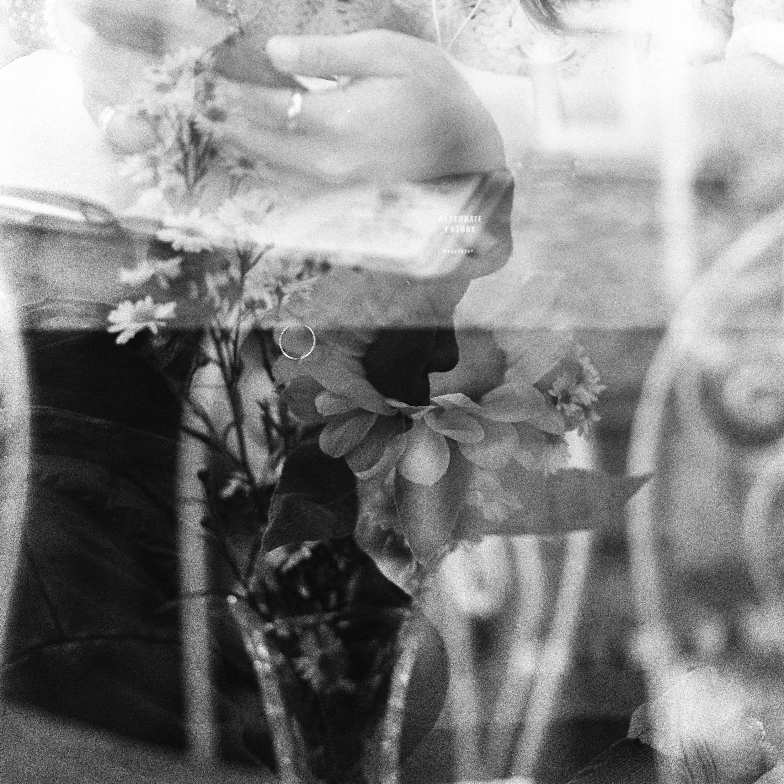 Double exposure of a figure and flowers